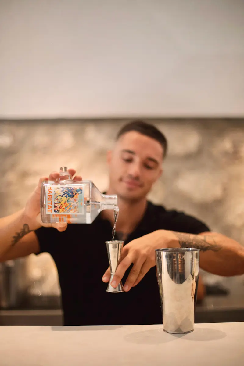 Bartender measuring spirits with precision